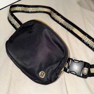 Lululemon wordmark belt bag. Color black/gold. Used a few times. Good condition